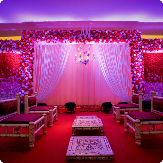Luxury wedding setup with pink lighting and decorations